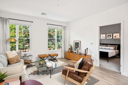 Spacious living room with green views in a Modera Framingham apartment.