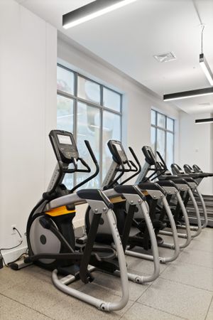 HIIT inspired fitness center with cardio and bike stations at Modera Framingham apartments.