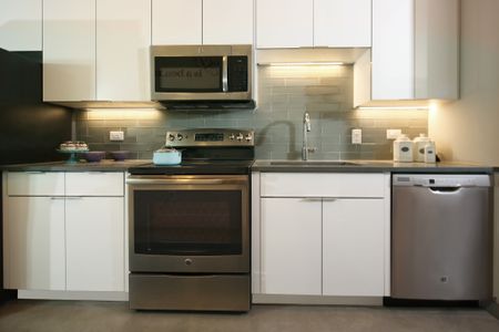 Stainless steel appliances in apartment kitchen at Modera Lofts, Jersey City apartments.