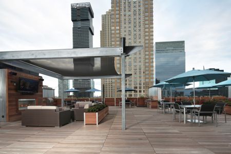 At Modera Lofts apartments enjoy a roof Top Lounge with Umbrella Seating