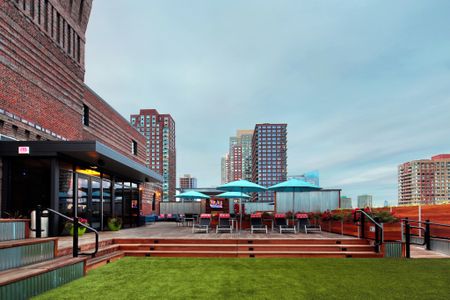 Roof Top Entertainment Center with Turf Grass at Modera Lofts apartments.