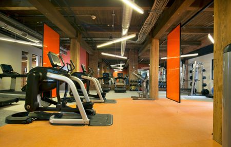 Expansive Fitness Center with Cardio Equipment at Modera Lofts apartments.