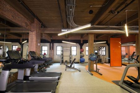 Fitness center with varying options at Modera Lofts apartments.