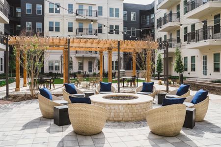 seating area around fire pit in courtyard at Modera Frisco Square apartments