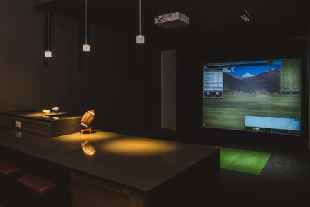 golf and game simulator at Modera Frisco Square apartments