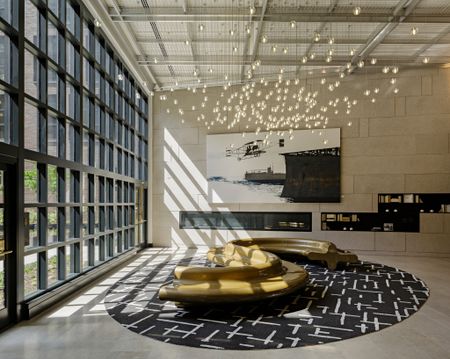 Resident Lounge with Floor to Ceiling Windows and Ornate Light Feature