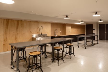 craft tables with seating and sinks at modera art park apartment homes for rent in denver colorado