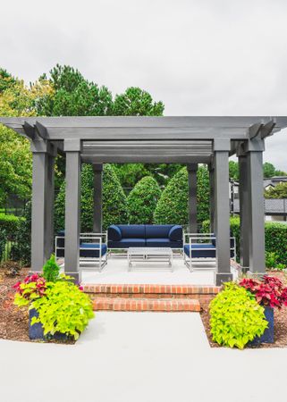 covered outdoor seating area at alister lake lynn apartment homes for rent in raleigh north carolina