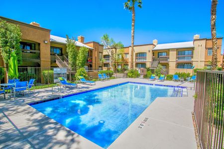 North Las Vegas Apartments - Desert Ridge - Relaxing Pool with Lounge Seating, Tables, Chairs and Greenery