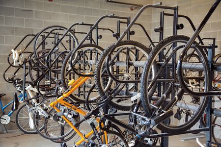 The indoor bike storage at our student housing near the University of Michigan, featuring bikes on metal racks.