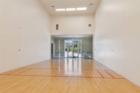 The racquetball court at our student apartments near Penn State, featuring a view of the fitness center.