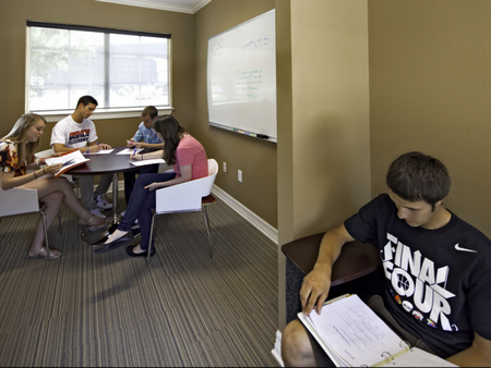 Five students using the study room at The Reserve on West 31st