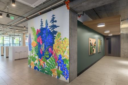 Image of a flower mural painted on the wall near the community mailboxes
