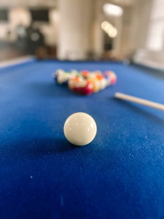 White pool ball on pool table