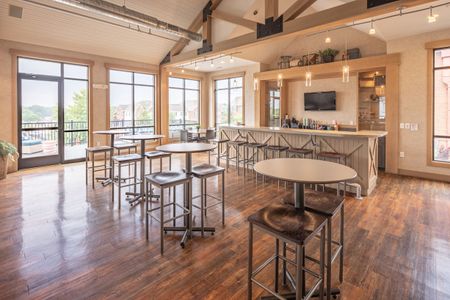 Community clubhouse with coffee bar and high top tables & chairs