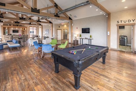 Community Clubhouse with plenty of seating and a pool table for residents to use