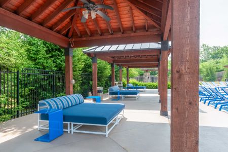 Outdoor lounge at our student apartments near Penn State, featuring grill stations and counter seating.