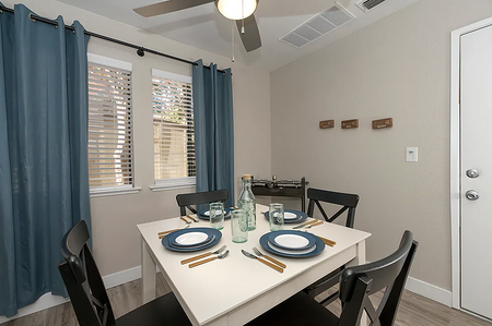 Avana Vista Point model dining room with windows and ceiling fan
