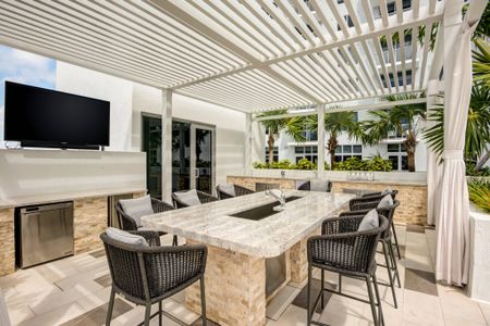 Outdoor kitchen space near pool at apartments near Hollywood, FL.
