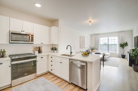 Sophisticated kitchen and living area in an Ossining apartment for rent.