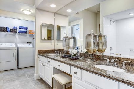 Spacious Primary Bathroom with Full-Sized Washer & Dryer