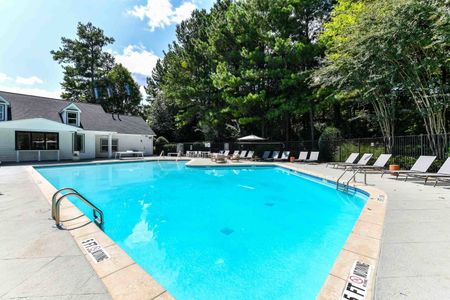 Community pool with sun tanning and lounge chairs with apartments for rent in Acworth, GA.