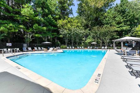 Community pool with sun tanning and lounge chairs with apartments for rent in Acworth, GA.