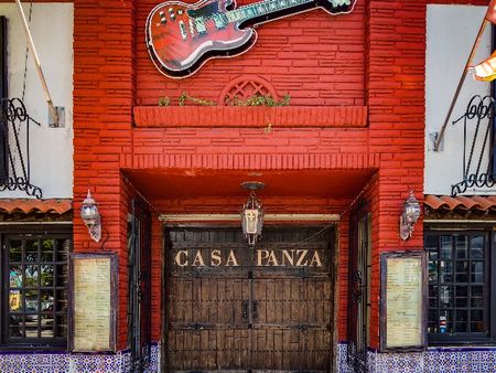 Photograph of the outside of a restaurant called CASA PANZA near our apartments in Miami. The storefront has a large red guitar.