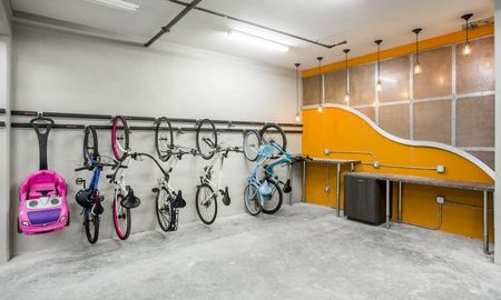 Bike storage area at our apartments in Boca Raton, featuring bike racks and a some work tests and lights.