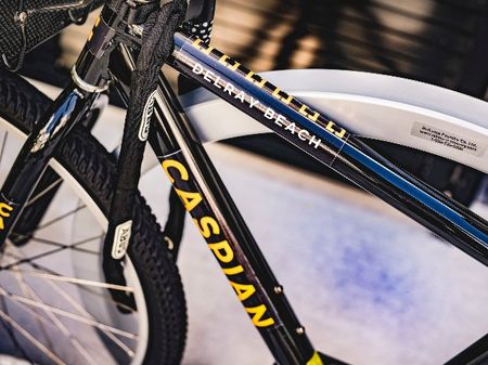Close up photograph of a bicycle at our apartments in Delray Beach, featuring a sticker on the frame that says "Caspian".