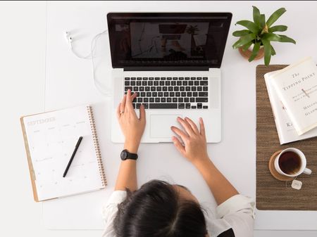 Woman on laptop leasing online