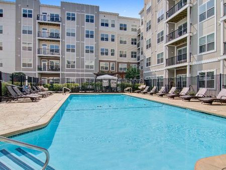 Resort-style pool surrounded by luxury apartments near Reading MA.