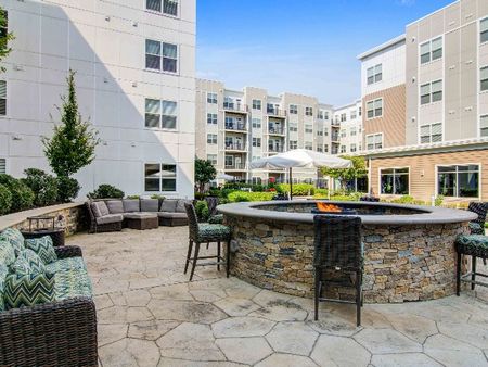 Community firepit and patio outside apartments in Wakefield MA.