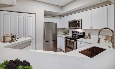 Kithen with white cabinetry in an apartment for rent in Pompano Beach, FL.