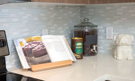Close up of a recipe book sitting on a kitchen counter in a rental community in Miami.