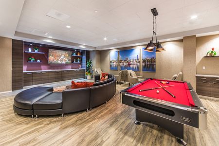 Rec room with billiards, ping-pong table, lounge, and massive flat-screen TV