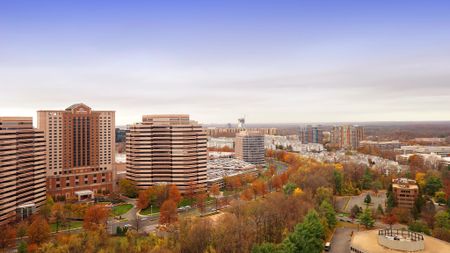 Aerial view of Tysons Corner, as seen from our apartments in McLean, VA, featuring a view of high rise buildings.