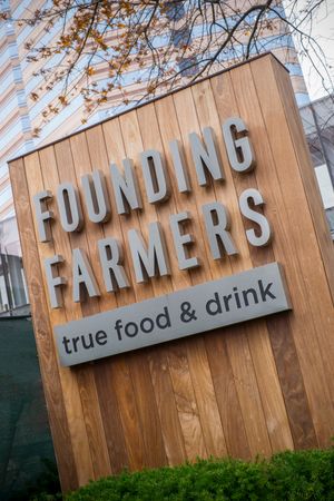 Sign at a market near our apartments for rent in McLean, featuring the words "Founding Farmers True Food And Drink"