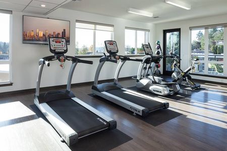 A gym with a variety of equipment in Kenmore apartments for rent.