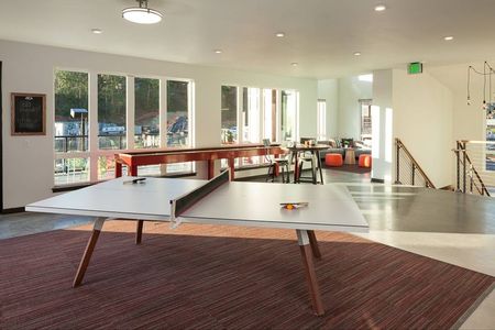 A ping pong table inside a resident community space in apartments near Seattle.