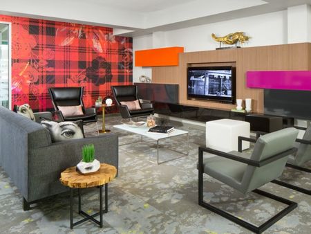 Avia Lowry's cyber lounge with Macbooks and a meeting space for residents to work from home.