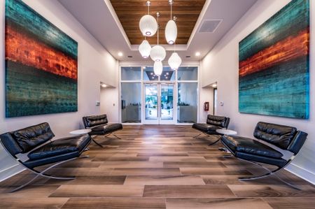 Hallway with modern art at downtown Delray Beach apartments.