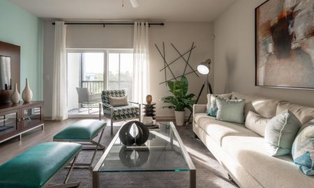 Light streaming into a beautiful living room in a Delray Beach apartment.