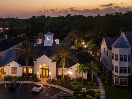 Exterior view of Avana Westchase's clubroom at dusk.