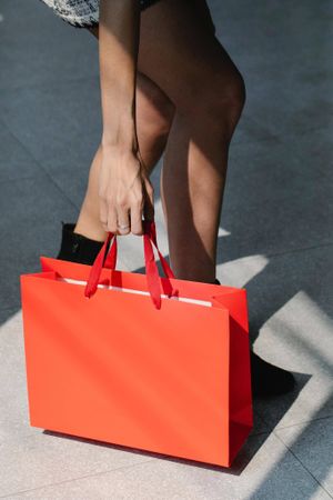 Lady with red shopping bag