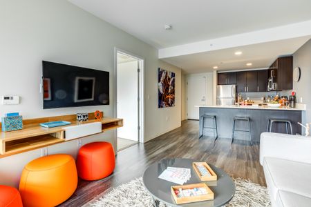 View of a spacious Cambridge apartments' luxury kitchen and living space.