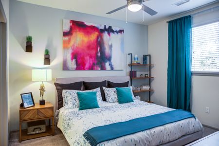 BedroomView of a luxury Denver one bedroom apartment living room with hard wood floors.