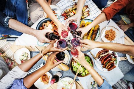 Friends toating over dinner