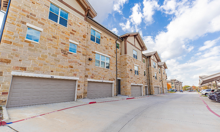 External view of garages attached to luxury apartments in Grapevine TX.