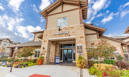 Exterior view of the entrance to the preserve apartments in Grapevine TX.
